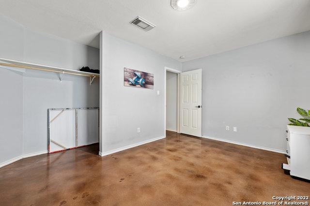 unfurnished bedroom with a closet