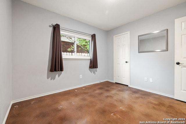 empty room featuring concrete floors