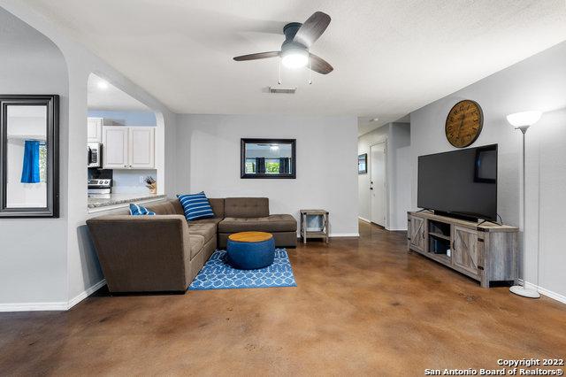 living room featuring ceiling fan