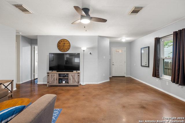 living room with ceiling fan