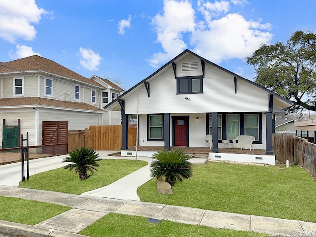 view of front of home featuring a front yard and covered porch