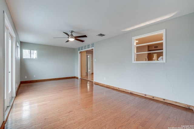 spare room with light hardwood / wood-style flooring and ceiling fan