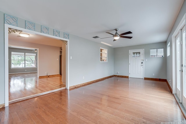 spare room featuring ceiling fan and light wood-type flooring