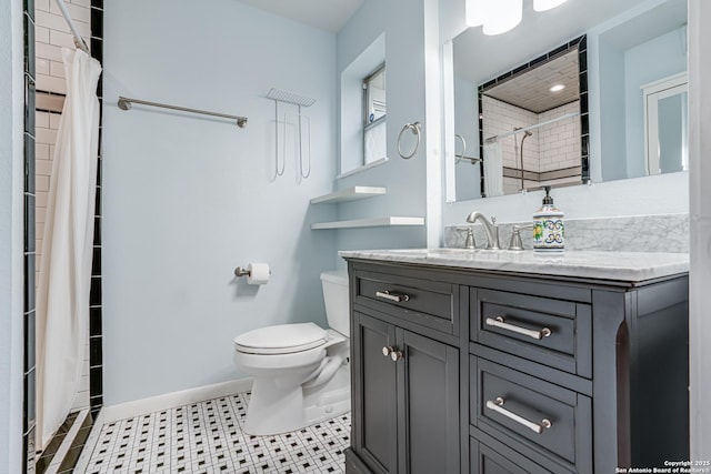 bathroom featuring a shower with curtain, vanity, tile patterned floors, and toilet