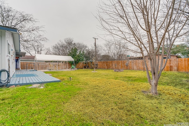 view of yard with a wooden deck