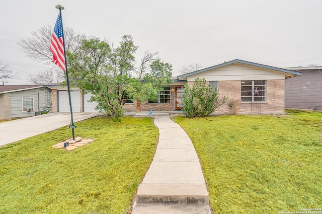 single story home with a garage and a front yard