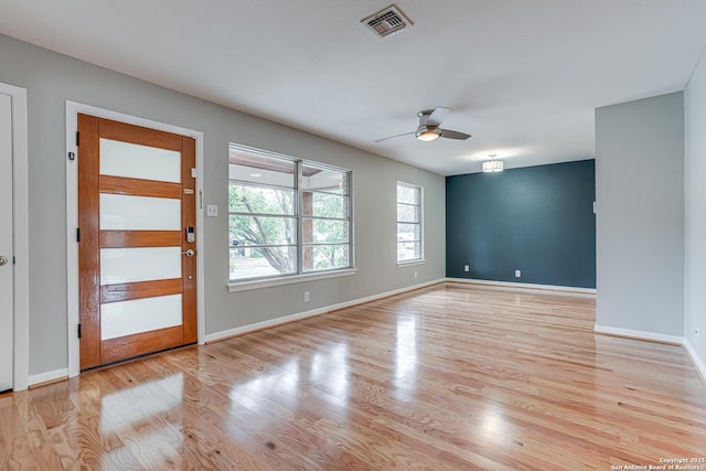 foyer featuring ceiling fan and light hardwood / wood-style floors