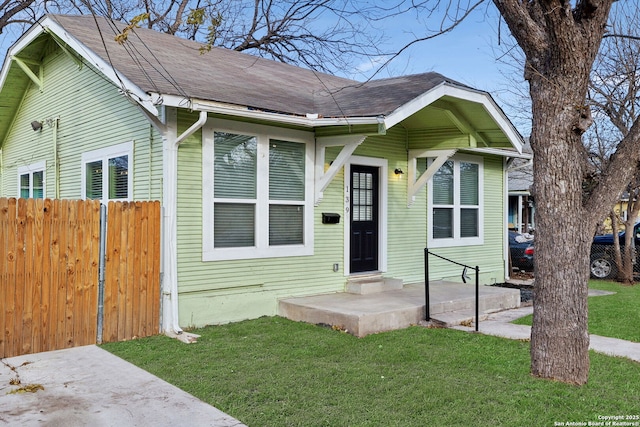 bungalow with a front lawn