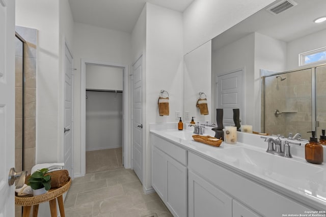 bathroom with vanity, tile patterned floors, and walk in shower