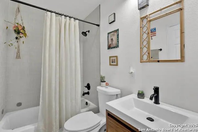 full bathroom with vanity, shower / bath combination with curtain, and toilet