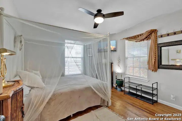 bedroom featuring hardwood / wood-style flooring and ceiling fan