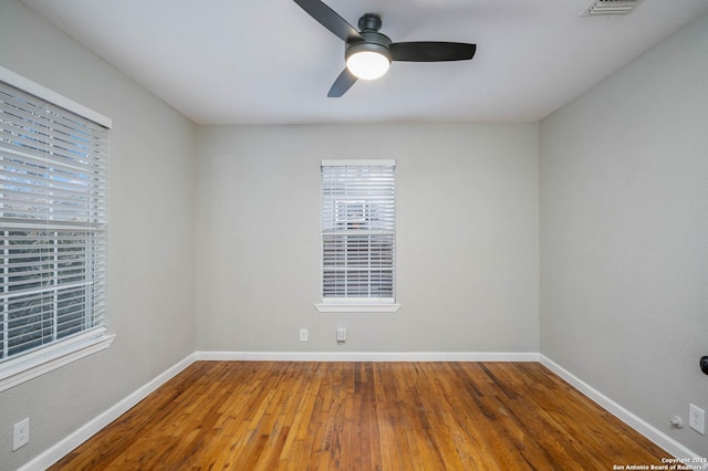 unfurnished room featuring ceiling fan and hardwood / wood-style floors