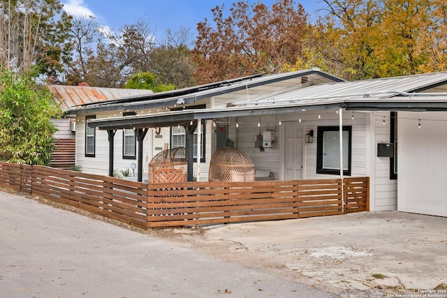 view of front of home with a carport