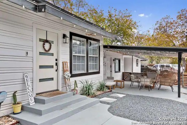 doorway to property with a patio area