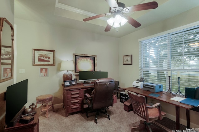 office space featuring ceiling fan, light colored carpet, and a raised ceiling