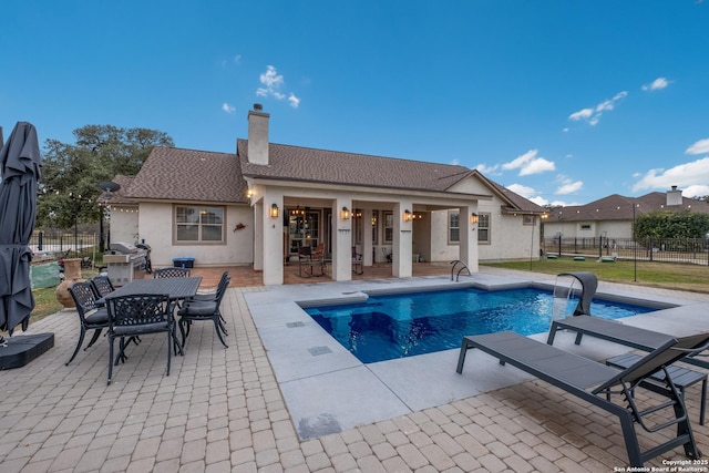 view of swimming pool featuring a patio area and pool water feature