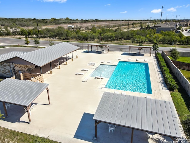 pool featuring a patio area, fence, and a gazebo