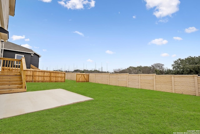 view of yard featuring a fenced backyard and a patio