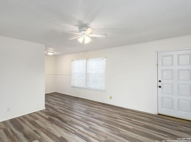 unfurnished room with ceiling fan, dark hardwood / wood-style flooring, and a textured ceiling