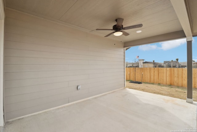 view of patio / terrace featuring a ceiling fan and fence