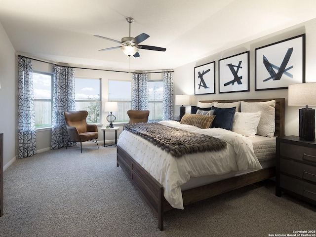 carpeted bedroom featuring baseboards and ceiling fan