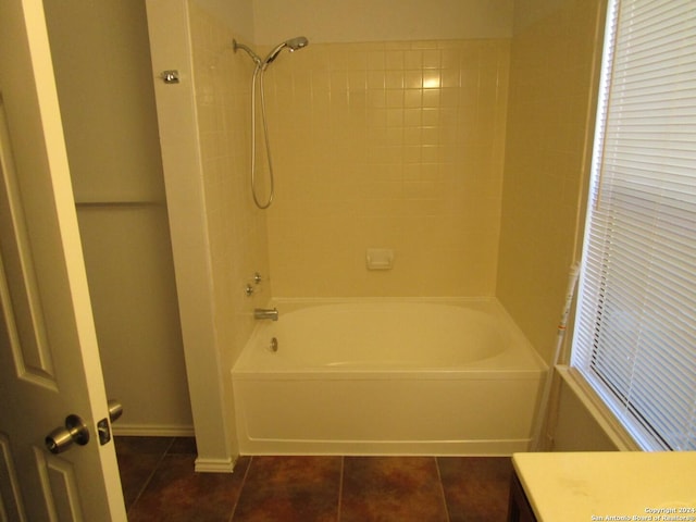 bathroom featuring vanity, tile patterned flooring, and shower / bathing tub combination