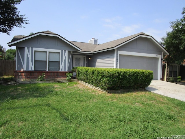 ranch-style home with a garage and a front yard