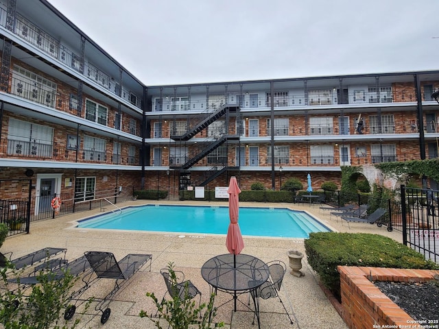 view of pool featuring a patio