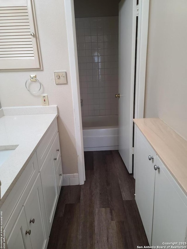 bathroom with vanity and hardwood / wood-style floors