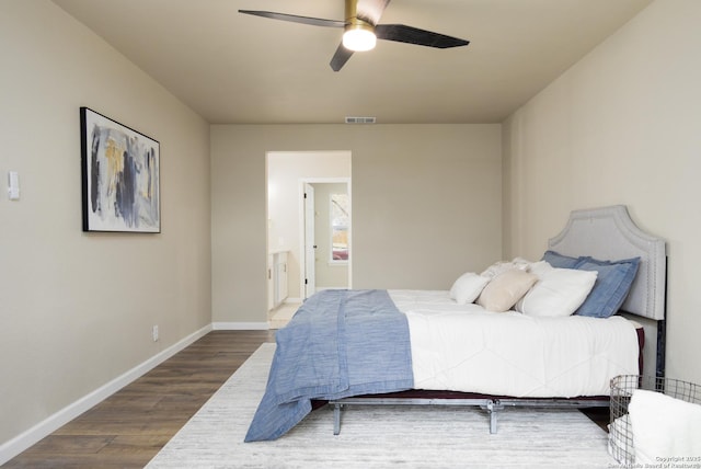 bedroom with ceiling fan and dark hardwood / wood-style floors