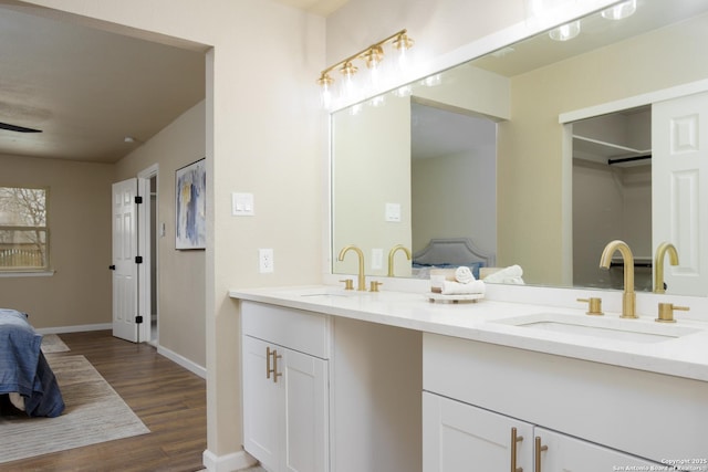 bathroom with vanity and hardwood / wood-style floors