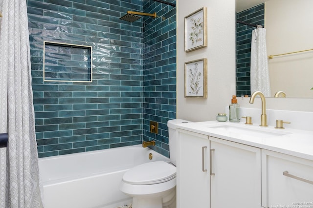 full bathroom featuring vanity, shower / bath combination with curtain, and toilet