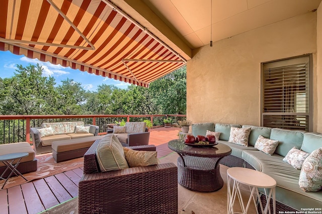 exterior space with a wooden deck and outdoor lounge area