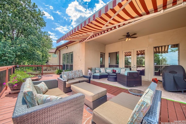 wooden deck with an outdoor living space, french doors, and ceiling fan