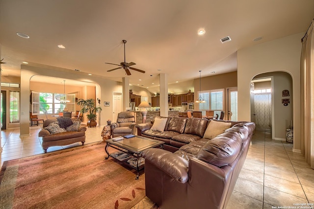 tiled living room featuring ceiling fan