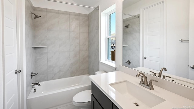 bathroom with toilet, bathtub / shower combination, and vanity