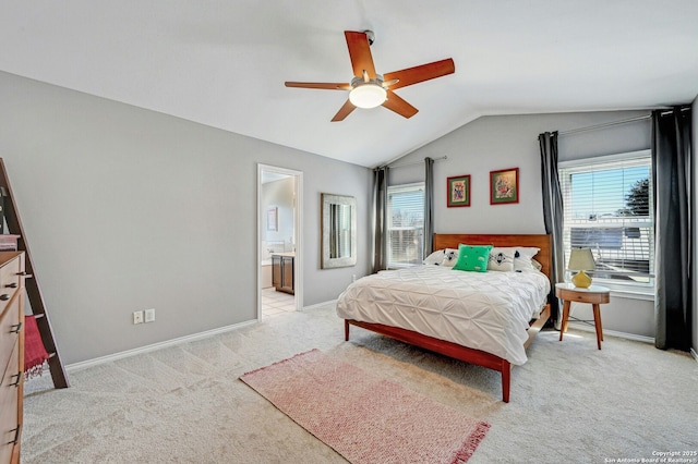 bedroom with baseboards, vaulted ceiling, a ceiling fan, and light colored carpet