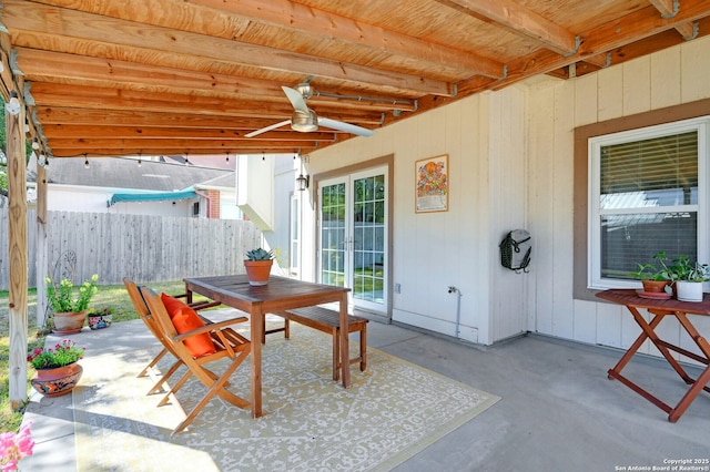 view of patio / terrace with outdoor dining space, ceiling fan, and fence