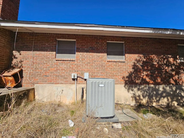 view of side of property featuring central AC