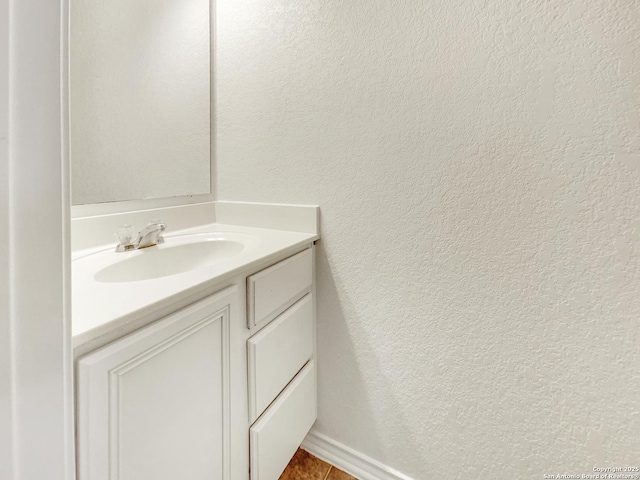 bathroom with vanity and tile patterned floors