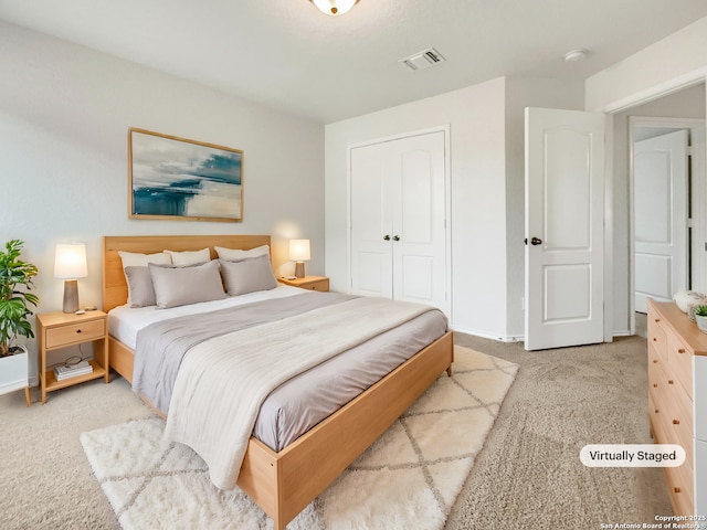 carpeted bedroom featuring a closet