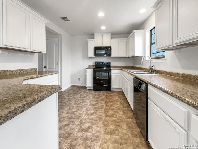 kitchen with white cabinetry, sink, and black appliances