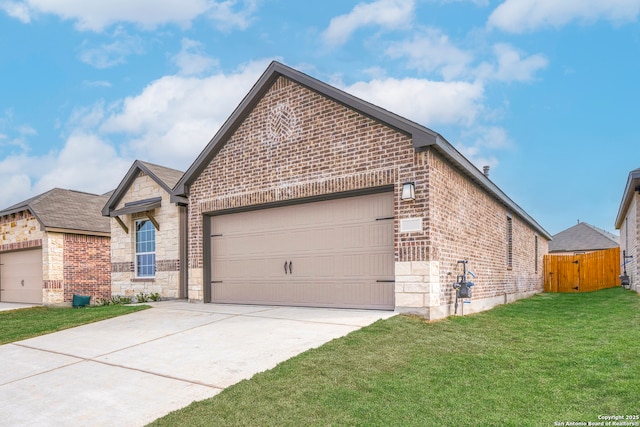 view of front of house featuring a garage and a front lawn