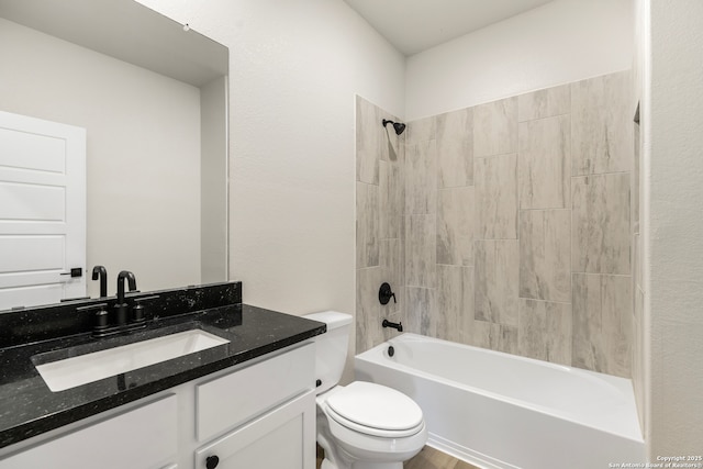 full bathroom featuring shower / bathtub combination, vanity, and toilet