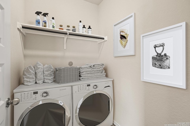 clothes washing area with independent washer and dryer