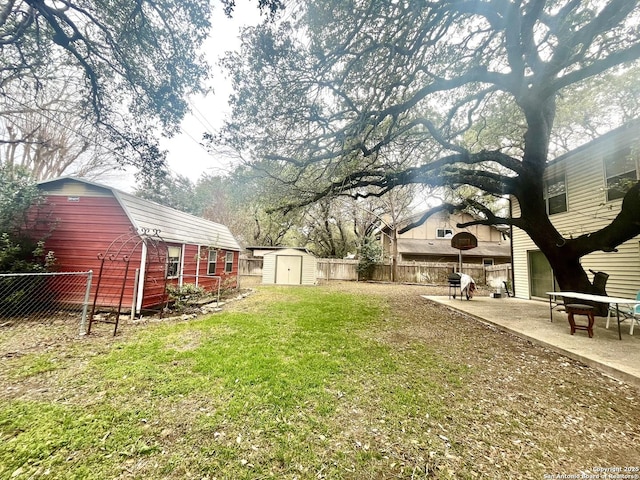 view of yard with a shed and a patio