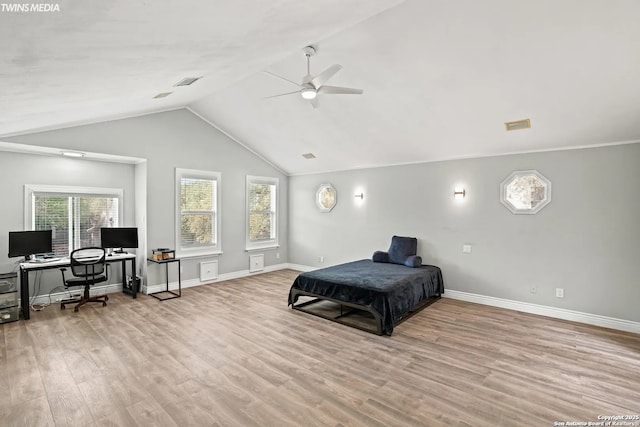 bedroom with vaulted ceiling, light hardwood / wood-style floors, and ceiling fan