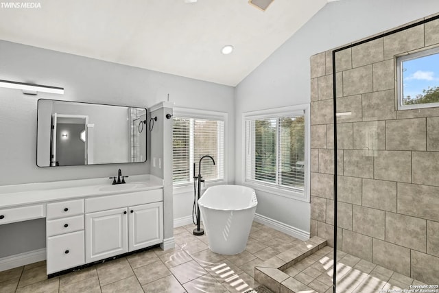 bathroom featuring lofted ceiling, shower with separate bathtub, tile patterned flooring, and vanity