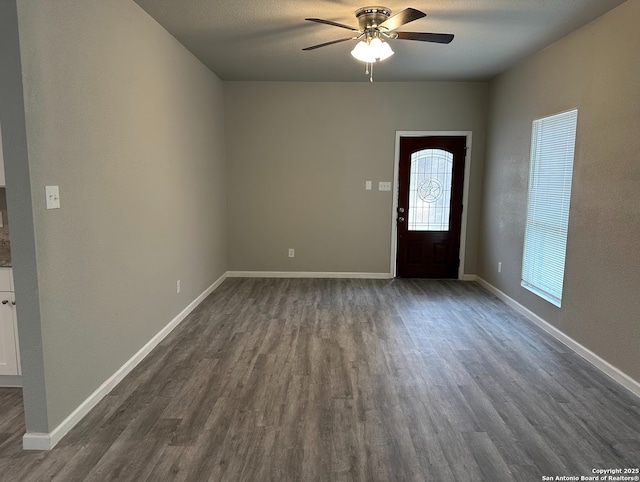 entrance foyer featuring ceiling fan and dark hardwood / wood-style floors