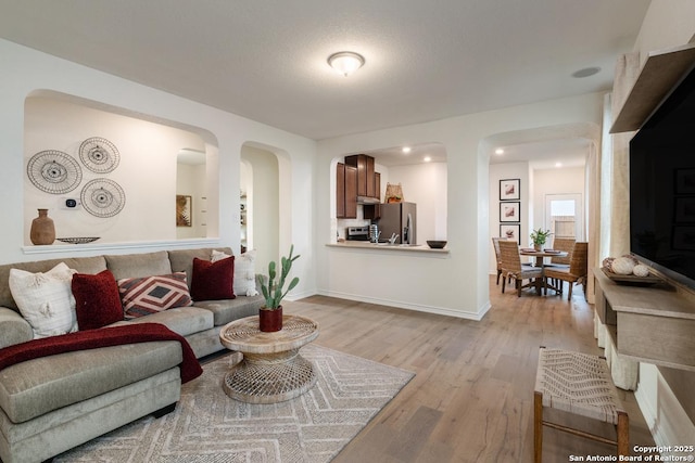 living room with light hardwood / wood-style flooring